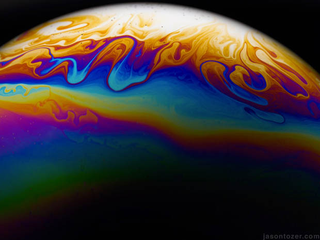 Illustration for article titled Photos of Soap Bubbles that Look Like Trippy Exoplanets